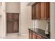 Hallway features built-in cabinets and dark countertops at 1668 E Saltsage Dr, Phoenix, AZ 85048