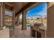 Enjoy outdoor dining with a view of the sparkling pool and manicured landscaping on this large covered patio at 1668 E Saltsage Dr, Phoenix, AZ 85048