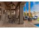 Covered patio has multiple seating areas and palm tree views at 1668 E Saltsage Dr, Phoenix, AZ 85048