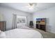 Well-lit bedroom featuring a bed, ceiling fan, and a window with exterior views at 16801 N 94Th St # 2005, Scottsdale, AZ 85260