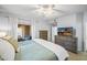 Spacious bedroom with balcony access and a dresser and television at 16801 N 94Th St # 2005, Scottsdale, AZ 85260