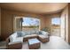 Relaxing covered patio with cozy sectional seating and views of the surrounding neighborhood at 16801 N 94Th St # 2005, Scottsdale, AZ 85260