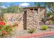 Community signage with stone accents and colorful landscaping at 16801 N 94Th St # 2005, Scottsdale, AZ 85260