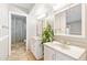Bathroom featuring dual sinks, mirror cabinets, and glass shower stall at 16824 N 38Th Dr, Phoenix, AZ 85053