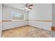 Neutral bedroom with window, ceiling fan, and tile flooring at 16824 N 38Th Dr, Phoenix, AZ 85053