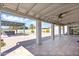 Expansive covered patio with ceiling fans and a view of the landscaped backyard featuring a pergola and hot tub at 16824 N 38Th Dr, Phoenix, AZ 85053