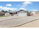 Single-story home boasting a tidy front yard with desert landscaping, a driveway, and a two-car garage at 16824 N 38Th Dr, Phoenix, AZ 85053