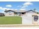Charming single-story home featuring a well-kept artificial lawn, desert landscaping, and a two-car garage at 16824 N 38Th Dr, Phoenix, AZ 85053