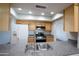 Granite countertops, stainless steel appliances, and wood cabinets make this a lovely kitchen at 16824 N 38Th Dr, Phoenix, AZ 85053