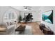 Open living room with piano, neutral decor, large windows, and seamless flooring at 16824 N 38Th Dr, Phoenix, AZ 85053