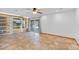 Open living space boasts custom shelving, shiplap walls, and a sliding glass door leading to the patio at 16824 N 38Th Dr, Phoenix, AZ 85053