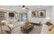 Living room featuring custom built-ins, a sliding glass door, and ample natural light at 16824 N 38Th Dr, Phoenix, AZ 85053