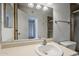 Bathroom featuring vanity with solid surface top and framed mirror at 1935 W Morten Ave # 17, Phoenix, AZ 85021