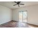 Bright bedroom with ceiling fan, Saltillo tile flooring and sliding glass doors to outside patio at 1935 W Morten Ave # 17, Phoenix, AZ 85021