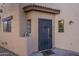 Close-up of a front entrance with secure iron door and tiled roof at 1935 W Morten Ave # 17, Phoenix, AZ 85021