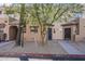 Charming townhome exterior with desert landscaping, secure doors and private entrances at 1935 W Morten Ave # 17, Phoenix, AZ 85021