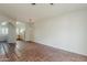 Open-concept living space with tile floors, arched doorway, and view into the kitchen at 1935 W Morten Ave # 17, Phoenix, AZ 85021