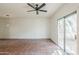 Bright living area featuring tile floors, a ceiling fan, and sliding glass doors at 1935 W Morten Ave # 17, Phoenix, AZ 85021