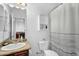 Bright bathroom featuring granite counters, updated fixtures, and a shower tub combo at 1950 N Center St # 101, Mesa, AZ 85201