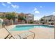 Community pool with a lounge chair, inviting clear water, and well-maintained surroundings at 1950 N Center St # 101, Mesa, AZ 85201