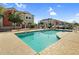 Community pool providing relaxation, featuring lounge areas and well-manicured surroundings at 1950 N Center St # 101, Mesa, AZ 85201