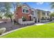 Charming townhome with stucco exterior, well-manicured lawn, and desert landscaping at 1950 N Center St # 101, Mesa, AZ 85201