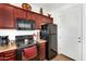 Galley kitchen with black appliances and ample cabinet storage at 1950 N Center St # 101, Mesa, AZ 85201
