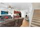 Open-concept living space with tile floors, ceiling fan, and staircase access at 1950 N Center St # 101, Mesa, AZ 85201