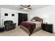Spacious main bedroom with a ceiling fan and comfortable furniture at 1950 N Center St # 101, Mesa, AZ 85201