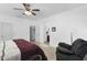 Bright main bedroom with a ceiling fan and access to a full ensuite bathroom at 1950 N Center St # 101, Mesa, AZ 85201