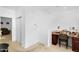 Bright office area with a built-in desk, cabinets, and neutral-toned carpet at 1950 N Center St # 101, Mesa, AZ 85201
