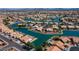 Scenic aerial view featuring waterfront homes, lush landscaping, and serene waterways in a vibrant residential community at 20327 N 110Th Dr, Sun City, AZ 85373