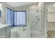Bright bathroom boasts a soaking tub, glass enclosed shower, and neutral color palette at 20802 N 74Th Ln, Glendale, AZ 85308
