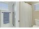 Bathroom with white shower curtain and metal towel rack at 20802 N 74Th Ln, Glendale, AZ 85308