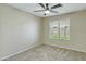 Cozy bedroom with neutral carpet, ceiling fan, large window allowing for natural light at 20802 N 74Th Ln, Glendale, AZ 85308