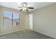 Comfortable bedroom with neutral walls, plush carpet, and bright natural light at 20802 N 74Th Ln, Glendale, AZ 85308