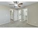 Neutral bedroom featuring carpet and doors to a bathroom and closet at 20802 N 74Th Ln, Glendale, AZ 85308