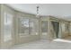Bright dining area featuring multiple large windows and a sliding glass door at 20802 N 74Th Ln, Glendale, AZ 85308