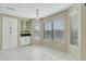 Bright dining area featuring large windows and a built-in serving cabinet at 20802 N 74Th Ln, Glendale, AZ 85308