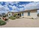 Backyard with neutral ground cover, garden beds, and covered patio off the house at 20961 E Stacey Rd, Queen Creek, AZ 85142