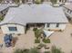 Aerial view of the house and backyard with desert landscaping and a playhouse at 20961 E Stacey Rd, Queen Creek, AZ 85142