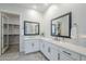 Bright bathroom with dual sinks, black framed mirrors, and white countertops at 20961 E Stacey Rd, Queen Creek, AZ 85142