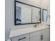 Bathroom vanity with a black-framed mirror and a white countertop at 20961 E Stacey Rd, Queen Creek, AZ 85142