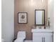 Powder room featuring a floating vanity with modern fixtures and stylish decor at 20961 E Stacey Rd, Queen Creek, AZ 85142