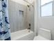 Bathroom with a tile shower, a bathtub and a white toilet at 20961 E Stacey Rd, Queen Creek, AZ 85142