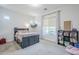 Bedroom with a bed, a nightstand and a window overlooking the outside at 20961 E Stacey Rd, Queen Creek, AZ 85142