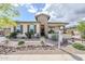Beautiful one-story home featuring desert landscaping, stone accents, and a welcoming front porch at 20961 E Stacey Rd, Queen Creek, AZ 85142