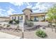 Attractive single-story home with desert landscaping, stone accents and a covered front porch at 20961 E Stacey Rd, Queen Creek, AZ 85142