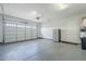 The spacious garage features an epoxy floor, and abundant room for storage at 20961 E Stacey Rd, Queen Creek, AZ 85142