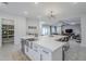 Bright kitchen boasts an oversized island, stainless steel appliances, and plenty of storage at 20961 E Stacey Rd, Queen Creek, AZ 85142